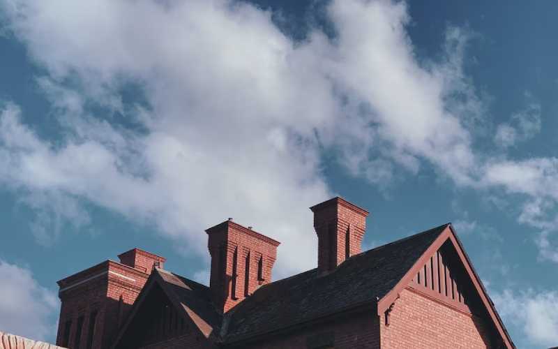 Roof of a red house with it's chimney